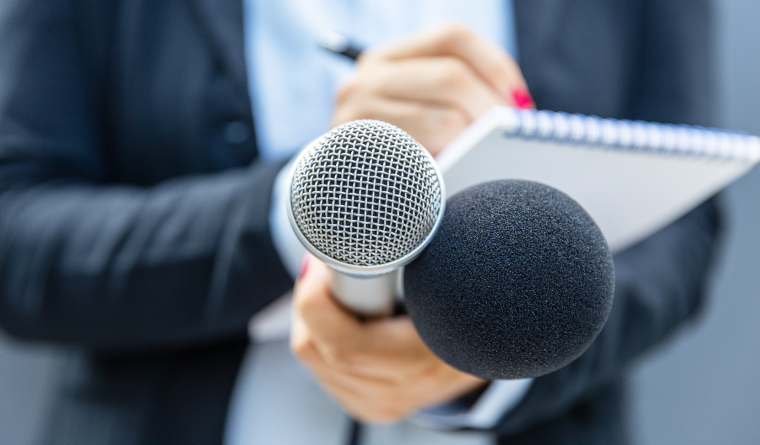 Thumbnail image of a spokesperson being interviewed, illustrating why companies partner with a PR agency